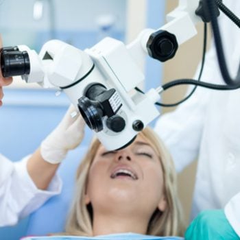 microscope over a woman's mouth