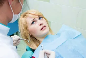 anxious woman in dental chair